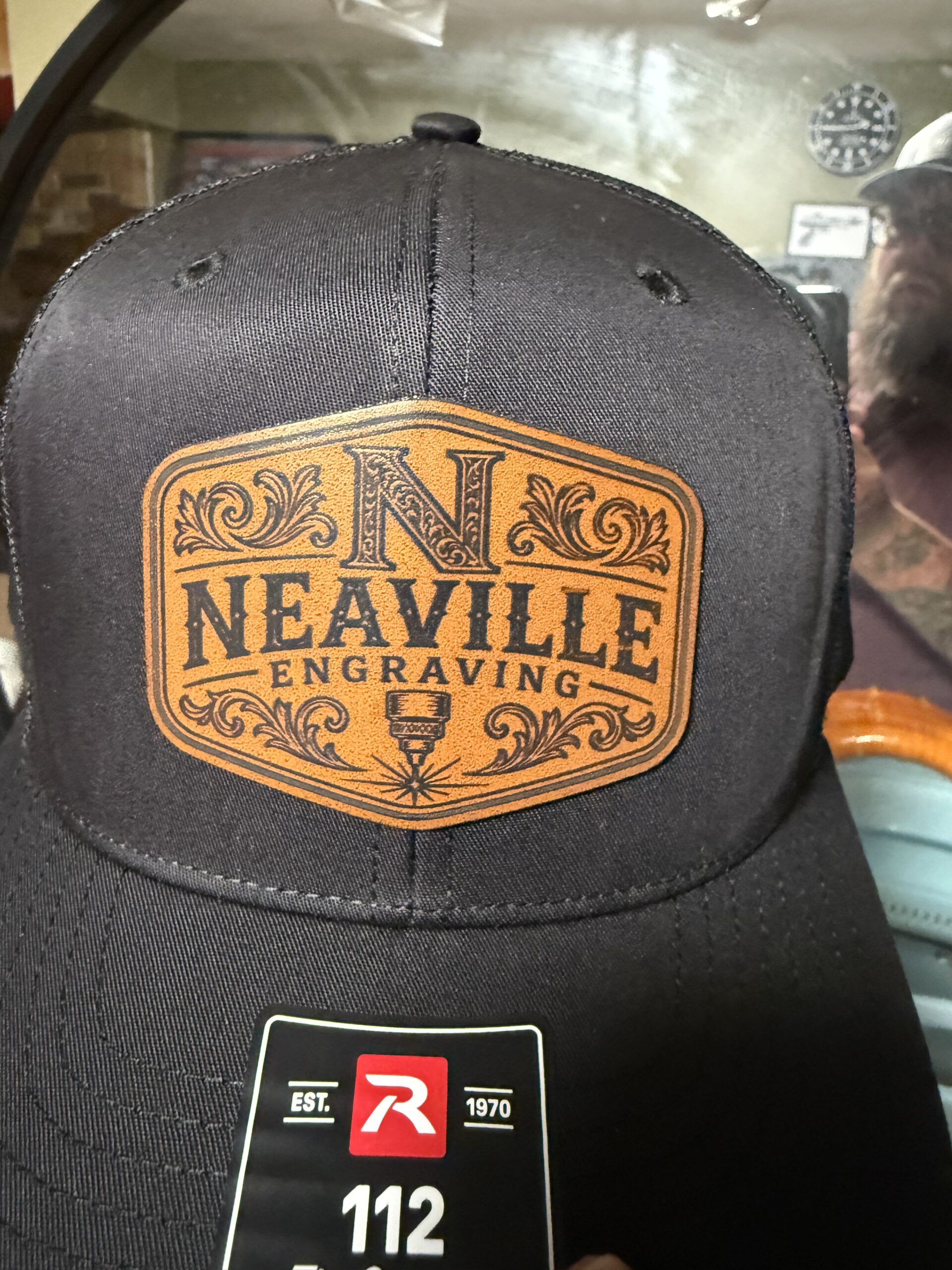 Custom hat featuring a Neaville Engraving logo patch